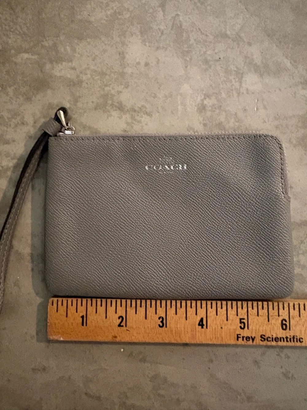 Coach Corner Zip wristlet in a metallic crossgrain leather